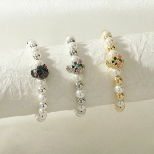 Detailed close-up of beaded Halloween bracelets with colorful skull charms and pearls