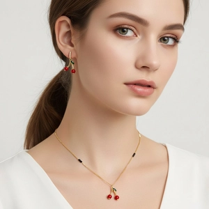 Elegant red cherry pendant necklace and earring jewelry set with green leaf details