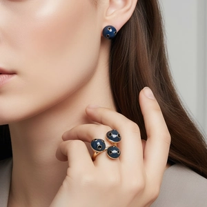 Polka dot blue enamel ring and earring set in gold-finished metal for a chic bionic look