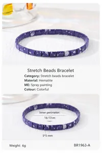 Close-up of Bohemian Tila bead bracelets with purple and yellow galaxy star pattern