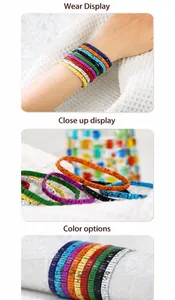 Detail showing colorful enamel Tila beads with artistic splatter patterns on elastic cord