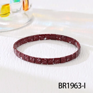 Detail of bohemian TILA beaded bracelet in wine red with white speckled texture