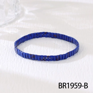 Detail view of handmade bohemian beaded bracelet featuring square blue stone beads