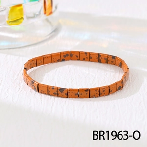 Detail of square beaded stretch bracelet with leopard print pattern and elastic design