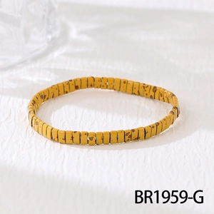 Macro detail of yellow Tila bead bracelet with leopard print and elastic band style