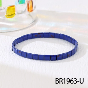 Detail of blue Tila bead elastic bracelet with bohemian style and speckled finish