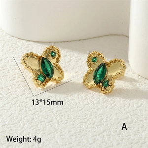 Detail of gold butterfly stud earrings featuring green marquise zircon and frosted wings