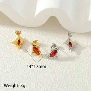 Detailed macro view of star-shaped stud earrings with red marquise zircon in 14x17mm size