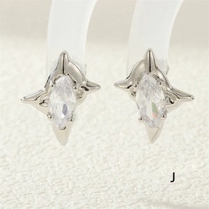 Macro shot of silver four-pointed star earrings with marquise-cut marquise cubic zirconia