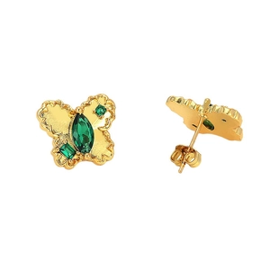 Gold butterfly stud earrings with emerald green zircon stones on a white background