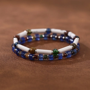 Close-up of handmade ethnic beaded bracelets with natural stones and Czech glass beads