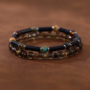 Detail of handmade bohemian beaded bracelets featuring natural stones and Czech glass beads