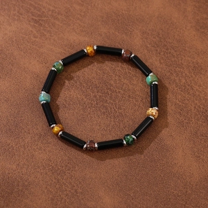 Detailed view of handmade beaded bracelet with natural stones and colorful Czech beads