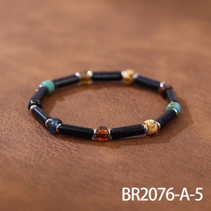 Detail of handmade bracelet with blue sandstone beads and colorful Czech crystal accents