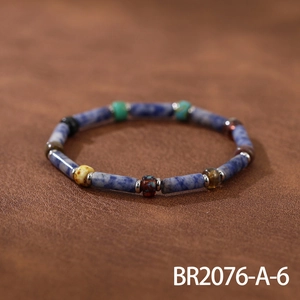 Detailed close-up of handmade beaded bracelet with blue marble stones and colorful Czech beads