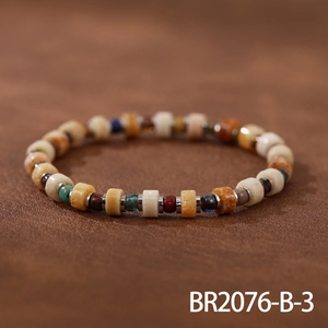 Detailed close-up of handmade ethnic bead bracelet featuring vintage natural stones and silver spacers