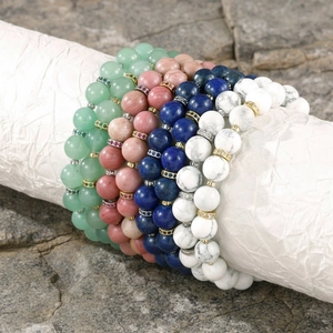Detailed view of stackable semi-precious stone beaded bracelets with sparkly spacer beads.