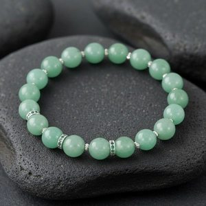 Green semi-precious stone beaded bracelet with sparkling silver accent beads for daily wear.