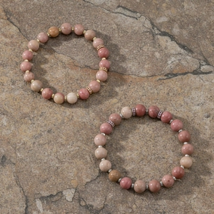 Detail shot of natural semi-precious stone beaded bracelets with metallic spacer beads. Elegant.