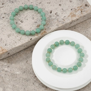 Green gemstone beaded bracelet with metal spacers, stylish elastic round bead jewelry.