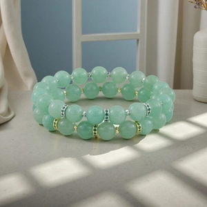 Double layer green gemstone beaded bracelet with sparkling metal spacer beads detail shot.