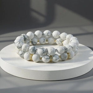 Double layer white gemstone beaded bracelet with metal spacers and stretch cord for daily wear.