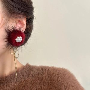 Elegant deep red plush ball earrings with pearl flower accent and long gold tassels