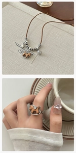 Detailed view of handcrafted wooden rocking horse ring in silver metal frame