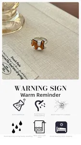 Detailed close-up of a wooden rocking horse ring with silver band on linen background