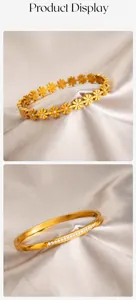 Dettaglio del bracciale a nodo dorato e del bracciale a margherita con diamanti