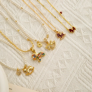 Vintage pearl and gold chain necklace set with horse charms and zircon accents
