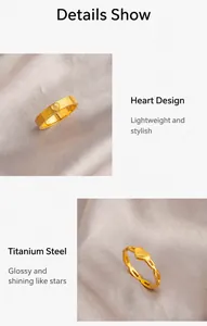 Close-up of gold titanium steel heart rings with textured and hollow chain details