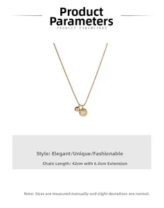 Detail of gold necklace featuring matte and polished spheres with 42cm plus 6cm chain