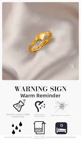 Detail view of gold heart ring on lavender silk with jewelry maintenance instructions