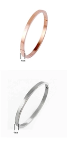 Detail view of 4mm minimalist polished stainless steel and rose gold hinged bangles