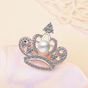 Elegant rose gold crown brooch with shimmering zircons and a central white pearl