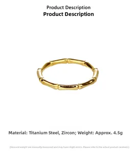 Macro view of gold bamboo-style titanium steel ring featuring sparkling zircon accents