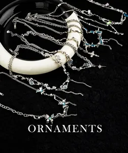 Detailed collection of silver titanium necklaces with butterfly, star, and pearl pendants