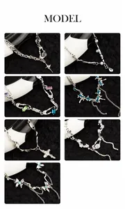 Macro detail of various Y2K silver necklaces with pearls and crystal pendants