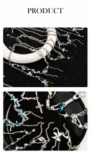 Detailed macro view of silver Y2K necklace with colorful zircons and butterfly pendant