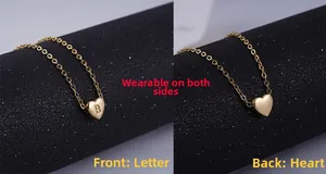 Double-sided gold heart pendant necklace showing front letter B and smooth back surface