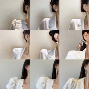 Collection de boucles d'oreilles pompons élégantes avec perles et zircon plaqué or