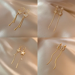 Boucles d'oreilles pendantes dorées avec strass et œil de chat en quatre modèles