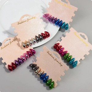 Macro shot of colorful metallic teardrop earrings set in various vibrant electroplated finishes