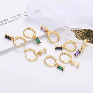 Detailed macro view of S925 silver stamp on gold-plated rectangular zircon earrings
