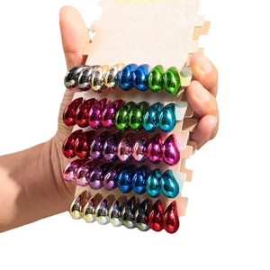 Polished metallic teardrop earrings set in various vibrant colors on display card