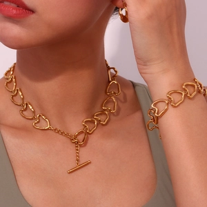 Polished gold stainless steel heart jewelry set with T-bar toggle necklace and bracelet