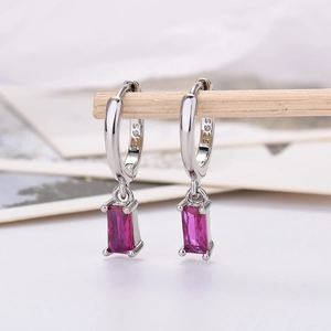 Close-up of S925 sterling silver hallmark on rectangular purple zircon drop earrings