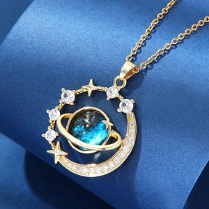 Detailed macro view of celestial blue nebula pendant with gold orbit and zircons
