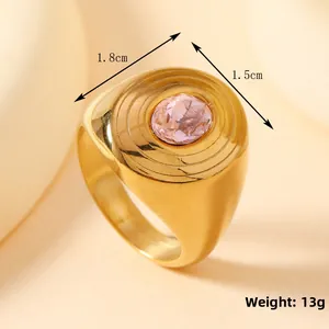 Macro shot of gold-plated ring showing 1.8cm width and pink oval gemstone detail